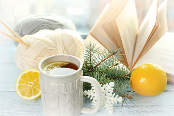 Fototapete - Beautiful winter composition on windowsill with cup of hot drink