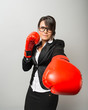 Business women with boxing gloves
