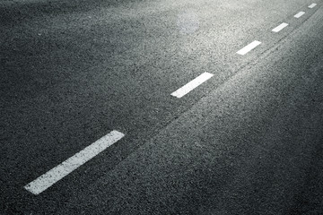 white dotted line on city asphalt road background.