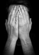 © dundanim - Depression concept of man covering face with hands