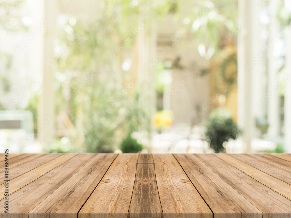 Wooden board empty table in front of blurred background. Perspective brown wood over blur in coffee shop - can be used for display or montage your products.Mock up for display of product. - obrazy, fototapety, plakaty 
