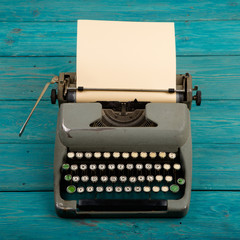 Fototapete - typewriter on the blue wooden desk