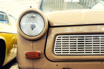 Wall Mural - Close Up of Headlight Lamp Vintage Classic Car. (Vintage Effect Style)