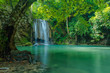 Green nature landscape with turquois waterfall