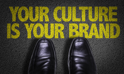 Top View of Business Shoes on the floor with the text: Your Culture Is Your Brand
