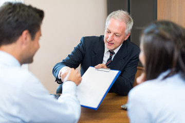 Sticker - Businessman talking to a couple