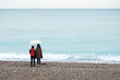 © maxime-me - People walking on a beach under umbrella
