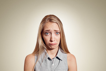 Wall Mural - Closeup portrait stressed frustrated woman crying or weep having temper tantrum isolated on wall background. Negative human emotion facial expression reaction attitude