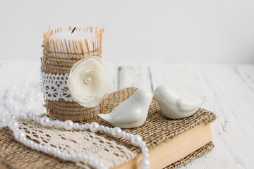 The book is in rustic style on a white table