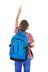 Little boy with glasses and back pack pointing finger upwards, isolated on white