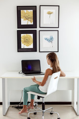 Wall Mural - Pre teen girl using laptop