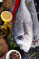 Canvas Print - Fresh fish dorado with fragrant spices, herbs and spices