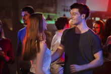 Young Attractive Couple Is Dancing Together At Bar 