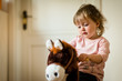© Martinan - Thoughtful girl on rocking horse
