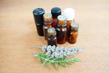 Essential Oils Bottles And Herbs