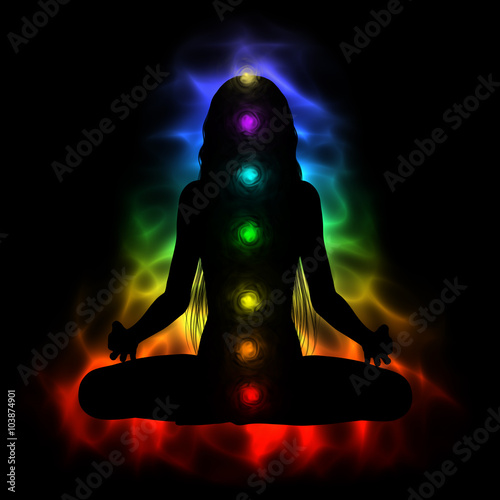 Obraz na plátně Silhouette of long hair woman meditating - colored chakras