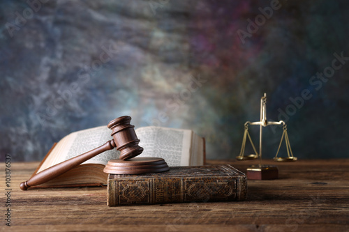 Fototapeta na wymiar Law theme, mallet of judge, wooden gavel, books