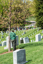 WASHINGTON D.C., USA - MAY, 2 2014 - Worker Is Cleaning Tombstones At Arlington Cemetery