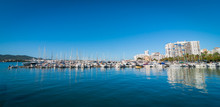 Sail Boats Idle In Ibiza Marina Harbor In The Morning Of A Warm Sunny Day In St Antoni De Portmany Balearic Islands, Spain.  