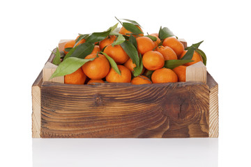 Poster - Fresh ripe mandarines in wooden crate.