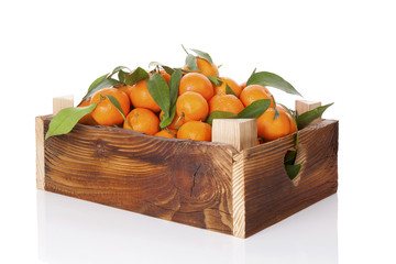 Wall Mural - Fresh ripe mandarines in wooden crate.