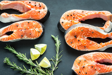 Wall Mural - Raw trout steaks on the wooden board