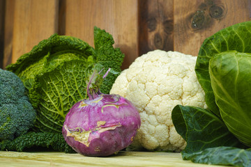 Fresh organic market vegetables on wooden background