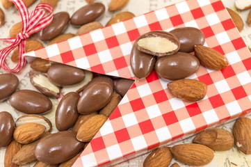 Fresh and chocolate covered almonds