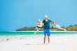 © travnikovstudio - Happy family at tropical beach having fun
