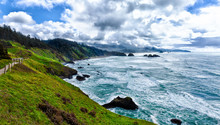 Green Grassy Cliffs Overlooking The Stormy Sea Along The Oregon Coast