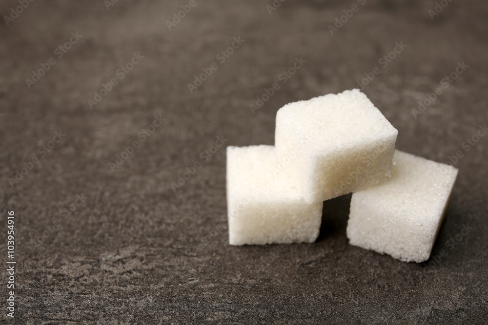 Pile of sugar cubes on the table