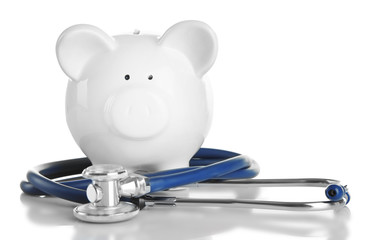 Wall Mural - Piggy bank with stethoscope isolated on white