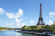Eiffel Tower Paris France vertical landscape looking across river seine and boats in the foreground photo vertical
