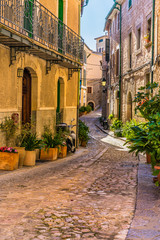 Fototapete - Beautiful view of an mediterranean alleyway with old buildings