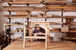 © mavoimages - Artisan manufacturing a wooden chair frame in his studio