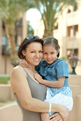 Wall Mural - mother with daughter near hotel