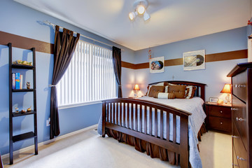 Wall Mural - Guest bedroom with periwinkle blue color interior and brown wood