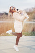 © sergiubirca - young caucasian cute girl portrait with dog outdoor in park walking happy and smile all the way