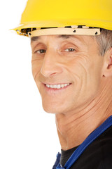 Smiling builder with a safety helmet