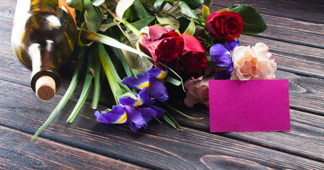 Poster - Tulips and a card on a wood