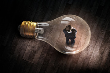 Wall Mural - Man inside of electric bulb