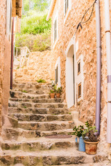 Fototapete - View of old stone stairs of an mediterranean mountain village