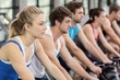 © WavebreakmediaMicro - Fit group of people using exercise bike together