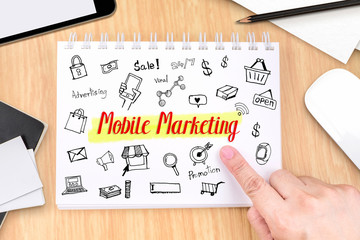 Poster - Hand pointing at Mobile Marketing on book with hand drawn featur