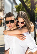 © dobok - young couple in sunglasses in summer, city outdoor