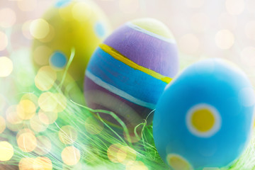 close up of colored easter eggs and grass