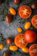 Wall Mural - Tomatoes mix  with herbs on the stone table vertical