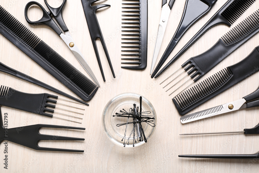 Barber set with tools on light wooden table