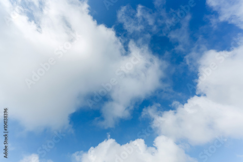 Naklejka ścienna fluffy cloud above blue sky background