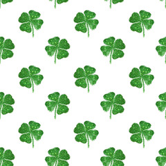 Wall Mural - Seamless pattern of abstract four-leaf clovers of green glitter